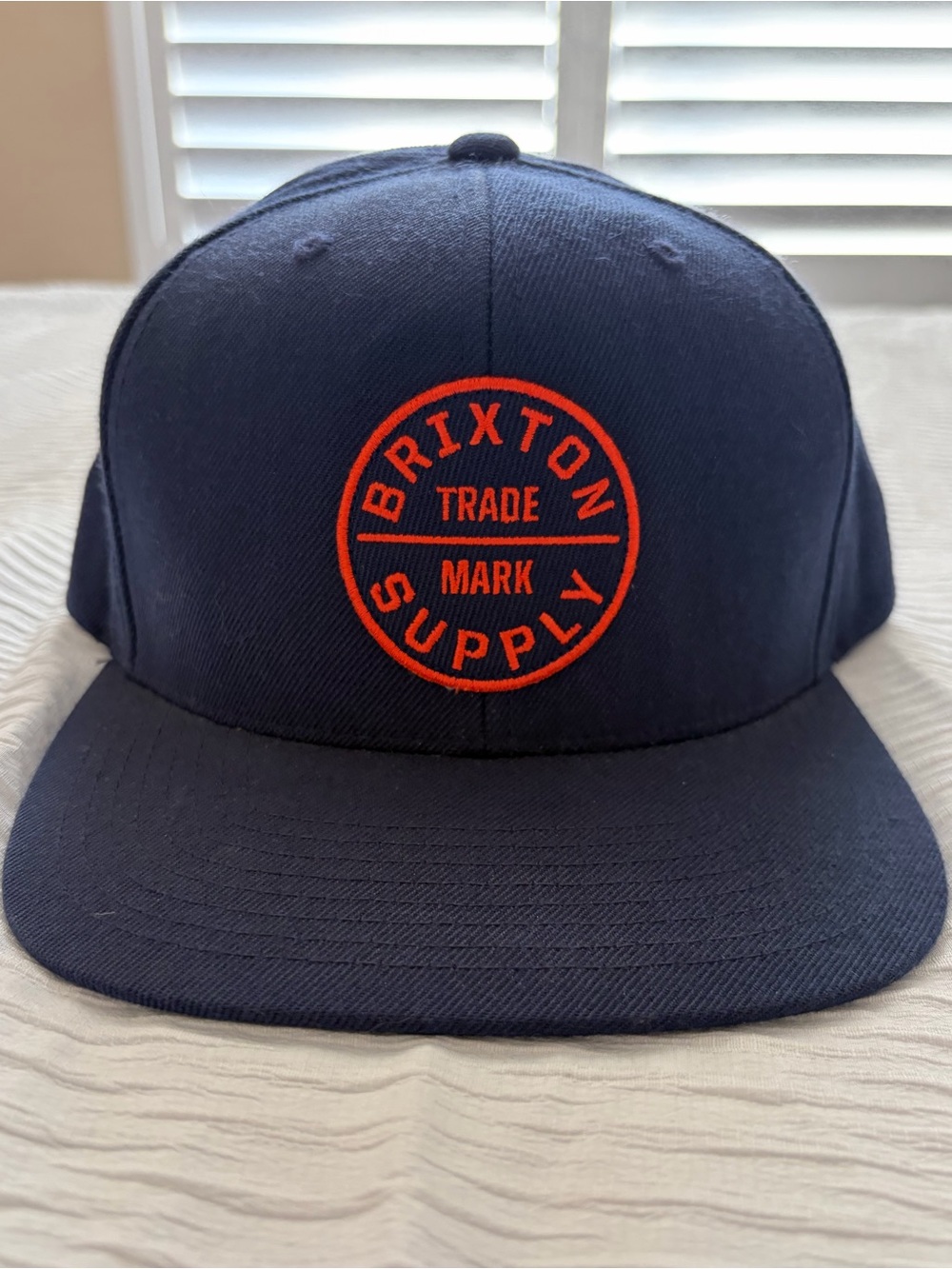 Brixton Navy Cap with Bright Orange Patch